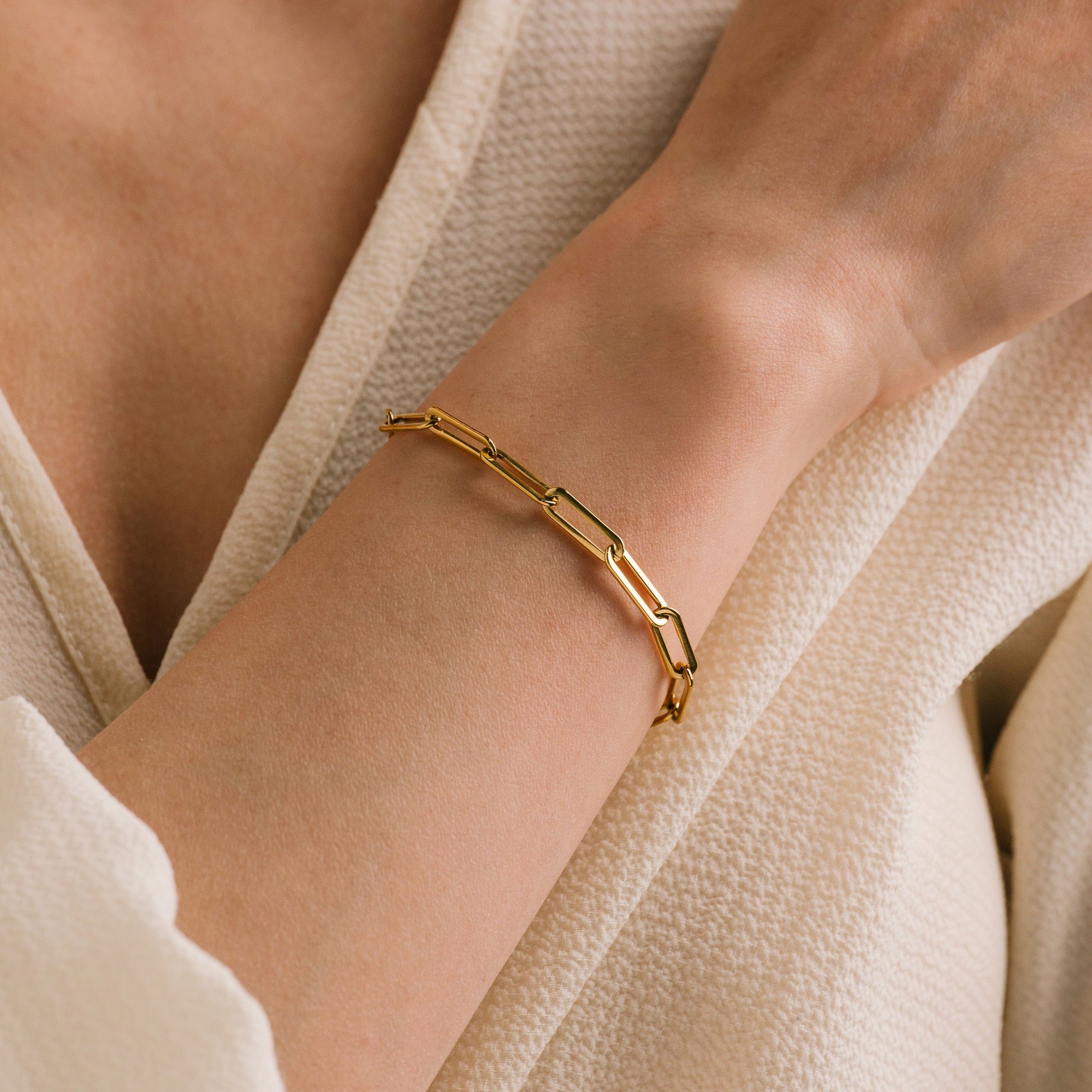 Bold paperclip bracelet in gold by Lover's Tempo, on the wrist