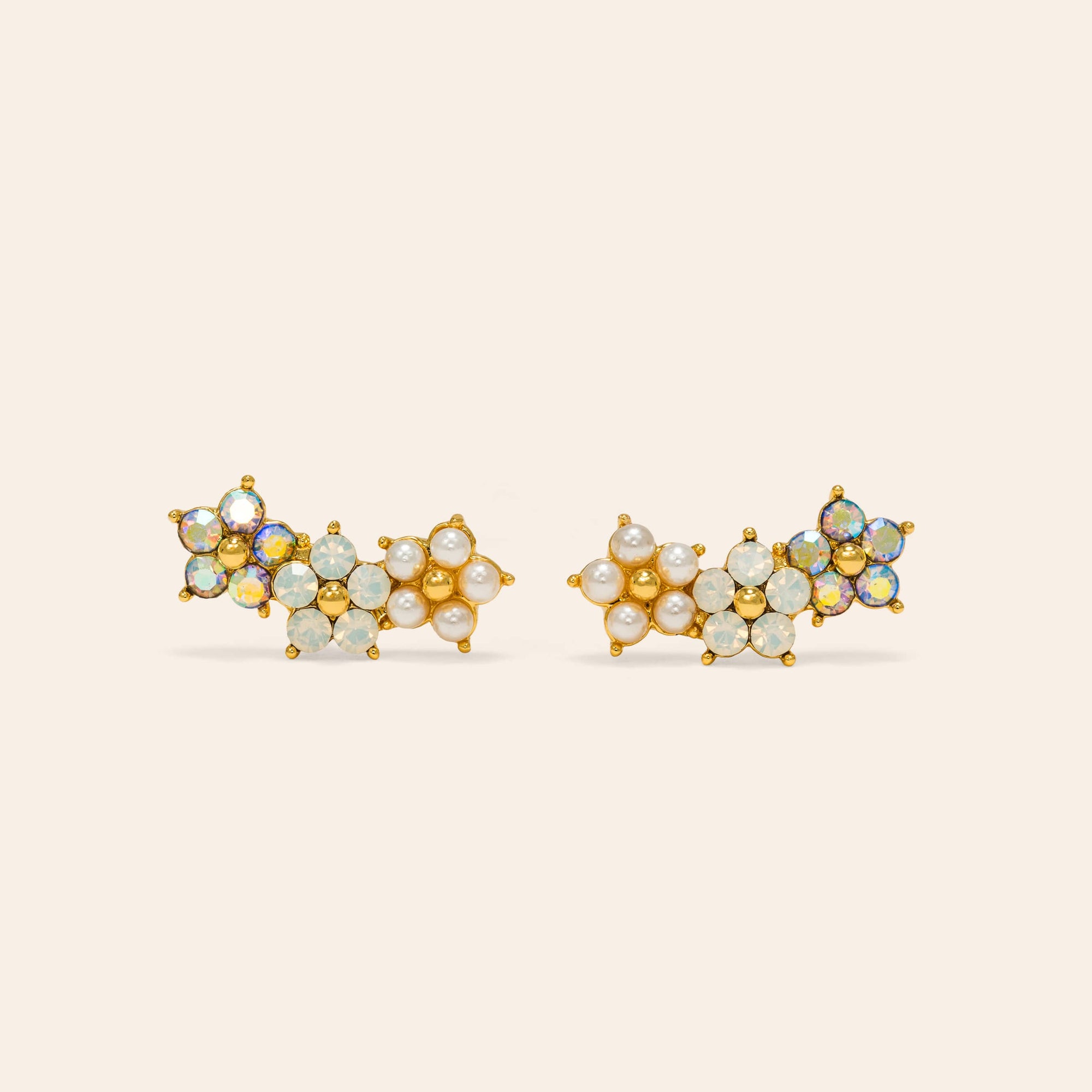 Floral climber earrings in white by Lover's Tempo