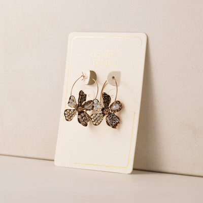 Primrose drop hoop earrings in white by Lover's Tempo, close-up
