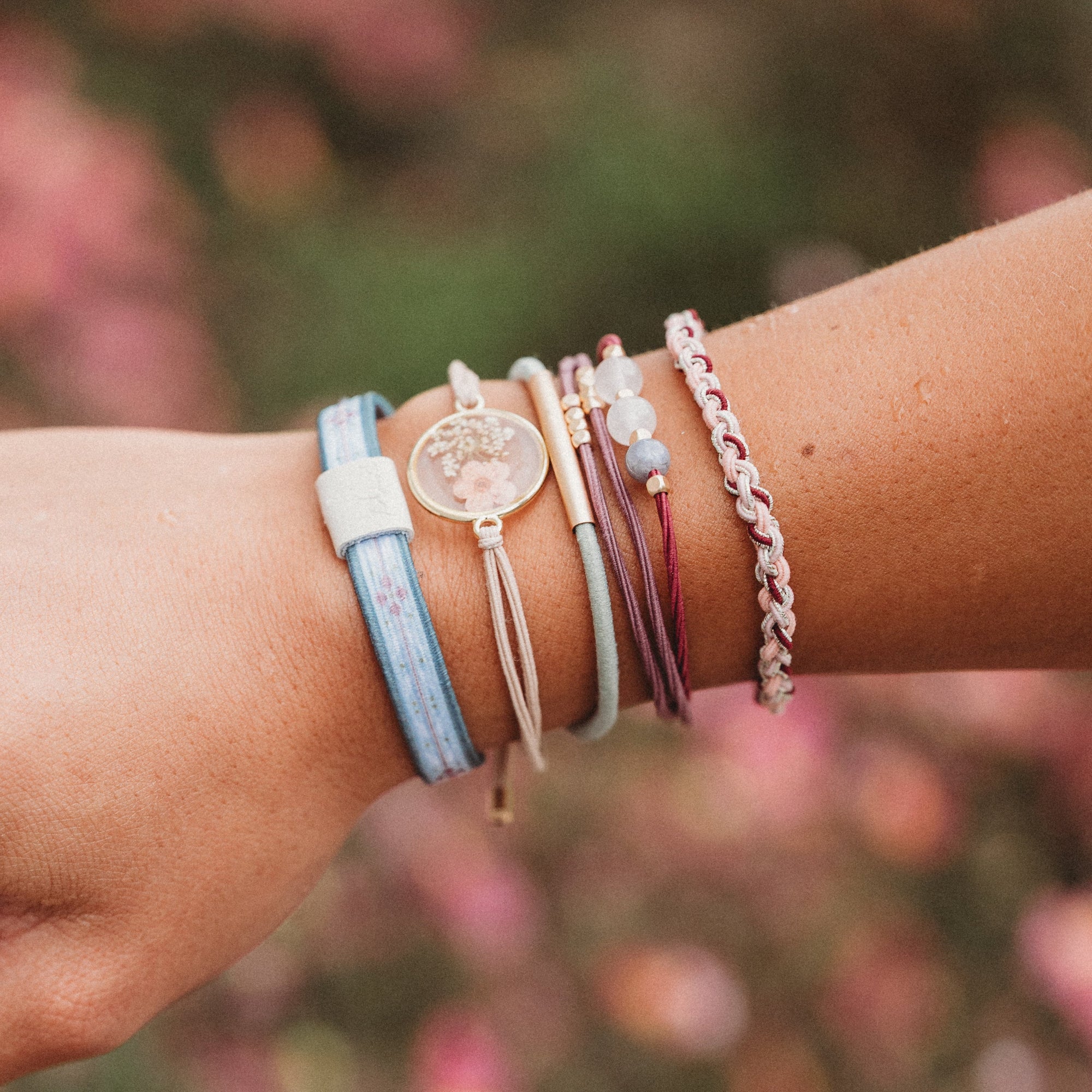 Bloom hair tie bracelet with gold charm and flower details